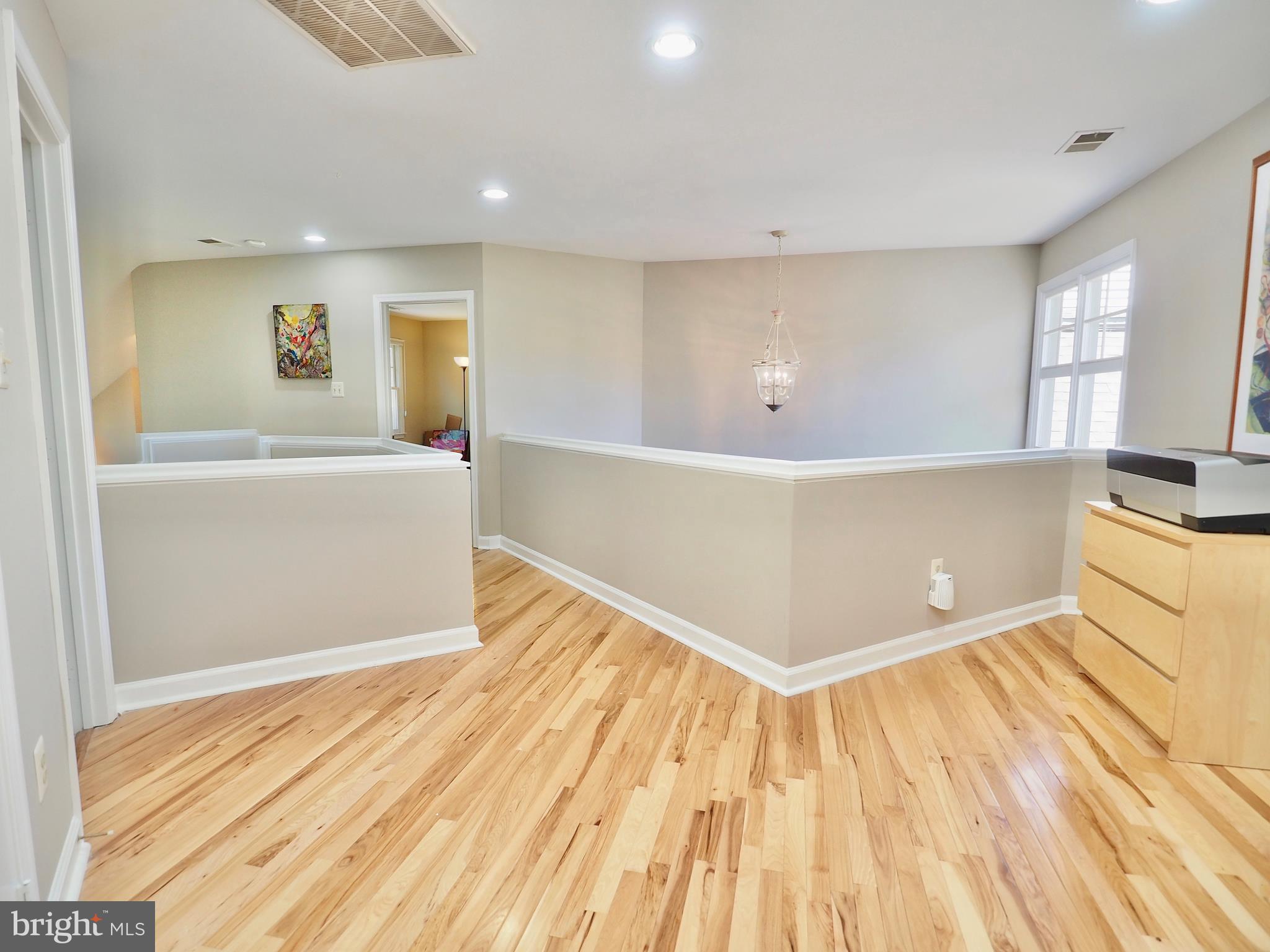 1312 Red Hawk Circle Reston, VA 20194 - Photo 37 of 48 Upper level hallway with hickory flooring
