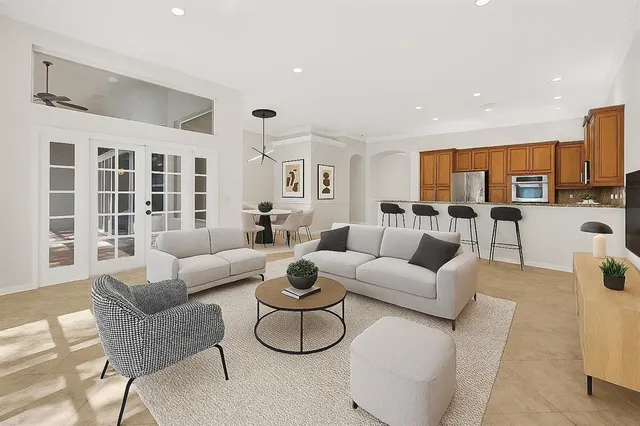 a bathroom with a double vanity sink mirror and bathtub