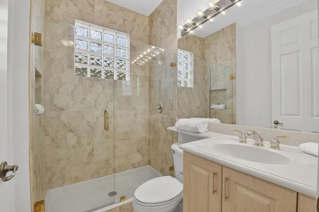 a large kitchen with stainless steel appliances granite countertop a large counter top and a stove top oven