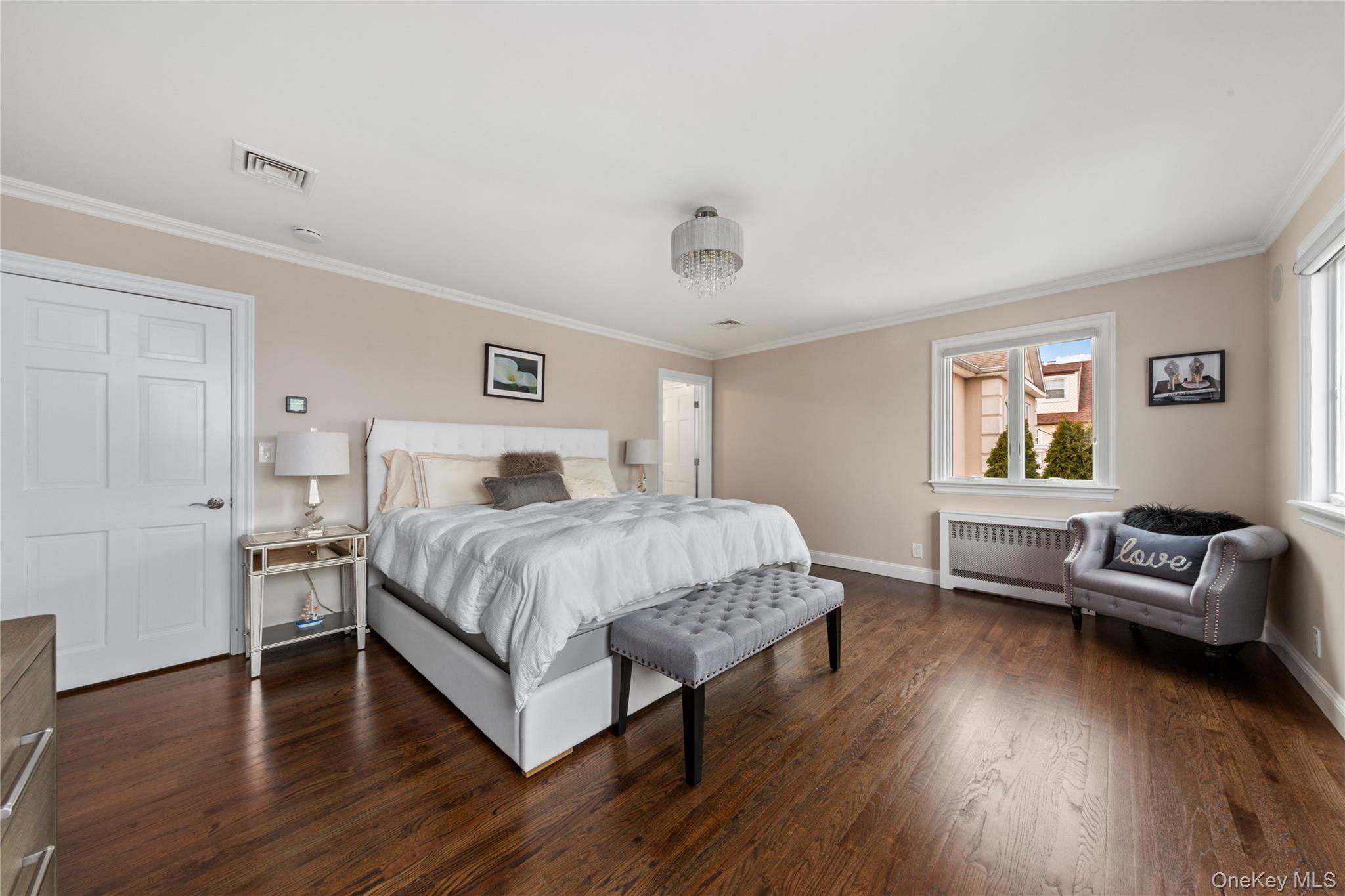 154-96 Riverside Drive Queens, NY 11357 - Photo 14 of 27 a bedroom with a bed and a couch
