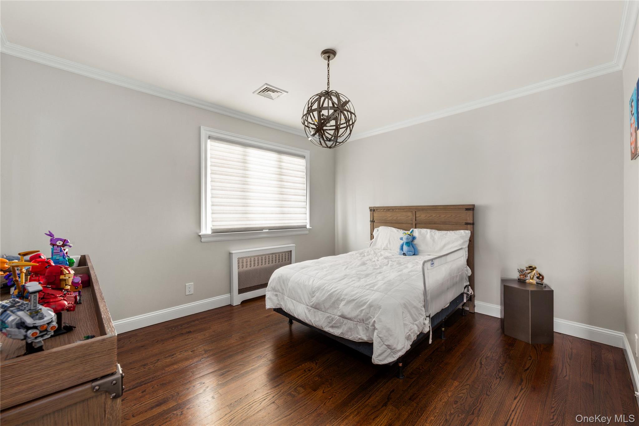 154-96 Riverside Drive Queens, NY 11357 - Photo 17 of 27 a bedroom with bed and a window
