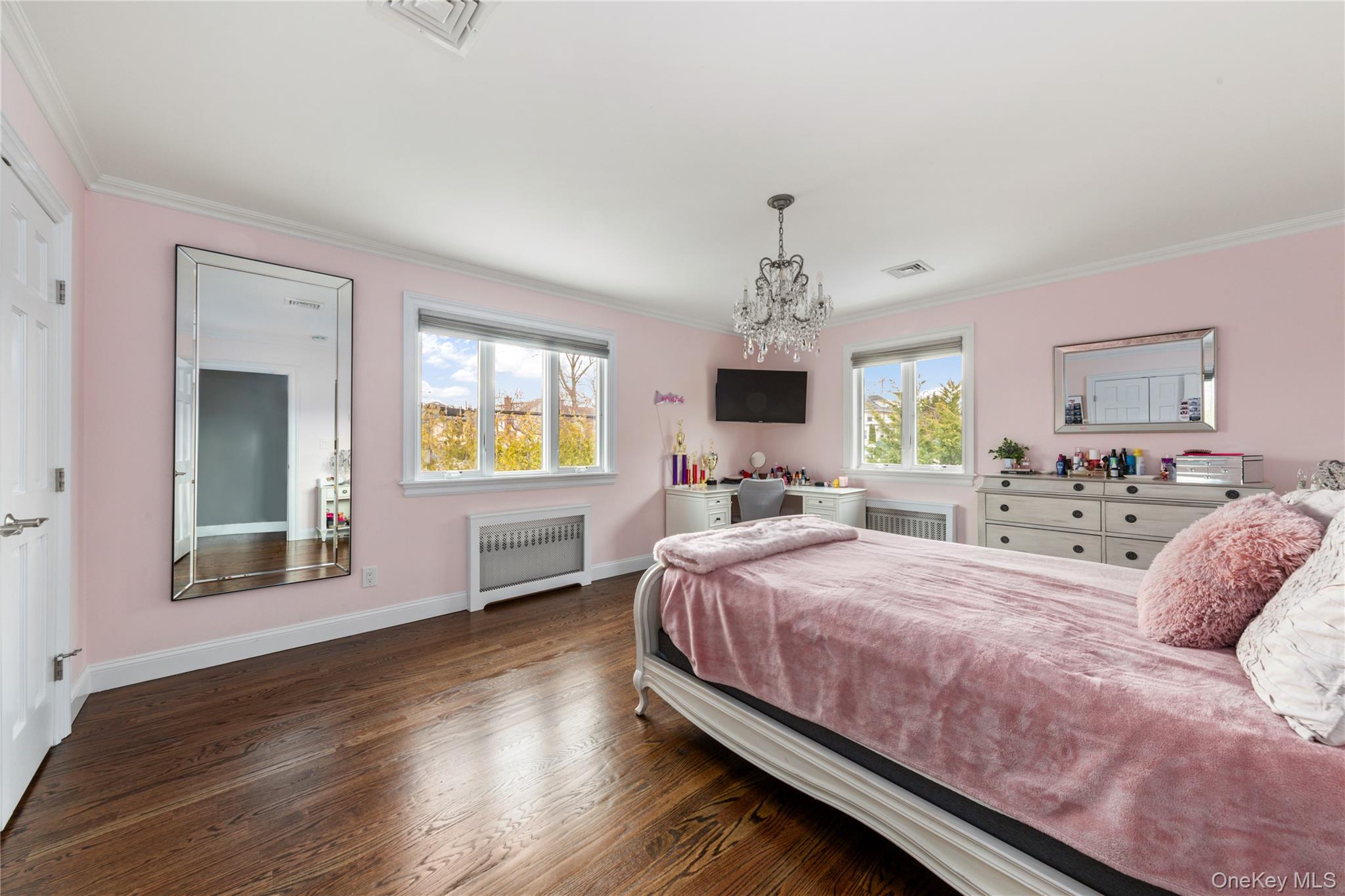 154-96 Riverside Drive Queens, NY 11357 - Photo 19 of 27 a bedroom with a bed and a window