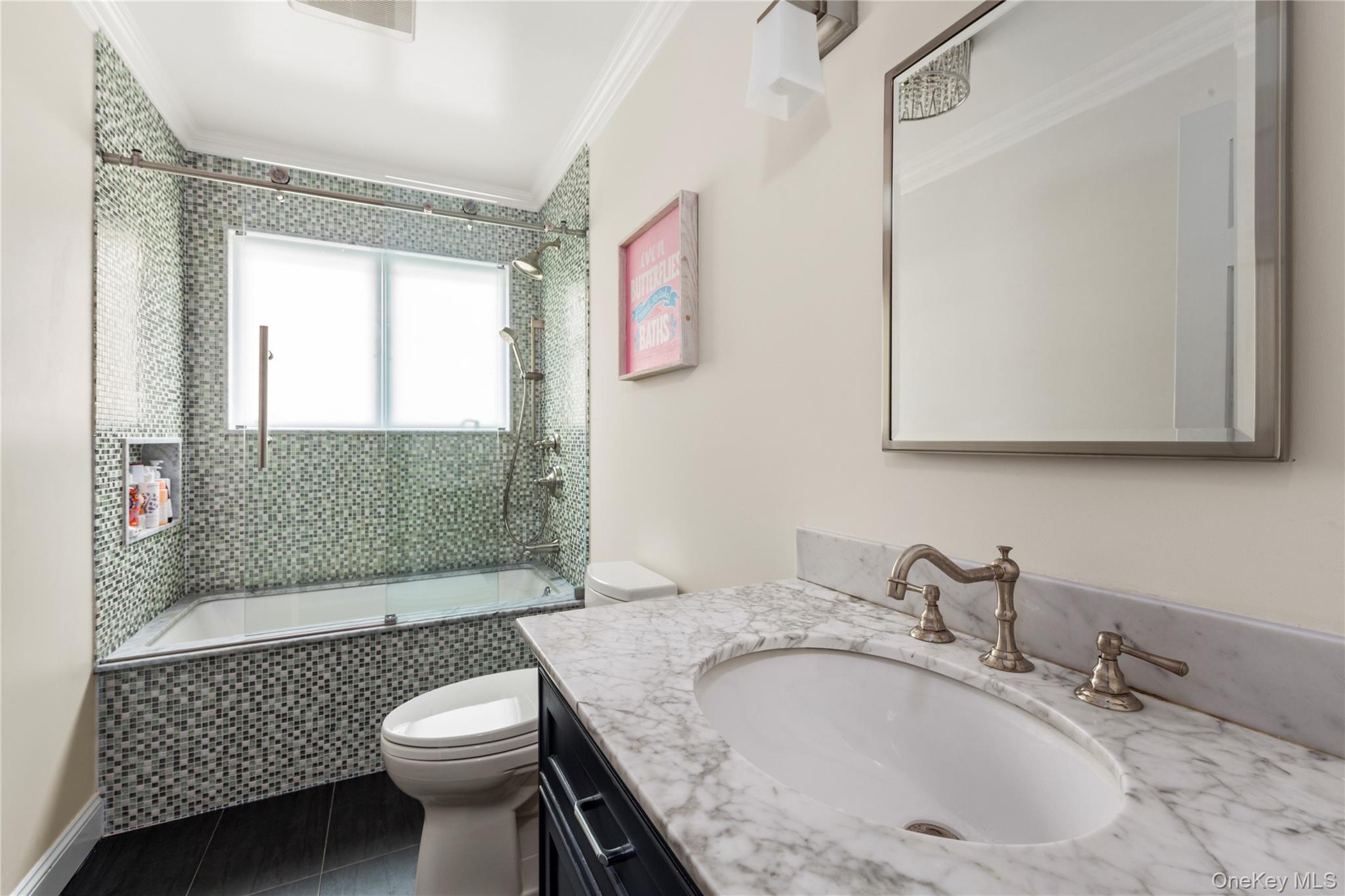 154-96 Riverside Drive Queens, NY 11357 - Photo 20 of 27 a bathroom with a granite countertop sink a toilet a mirror and shower