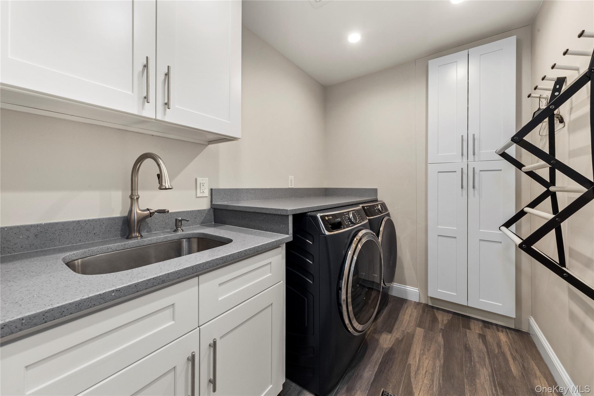 154-96 Riverside Drive Queens, NY 11357 - Photo 21 of 27 a utility room with sink dryer and washer