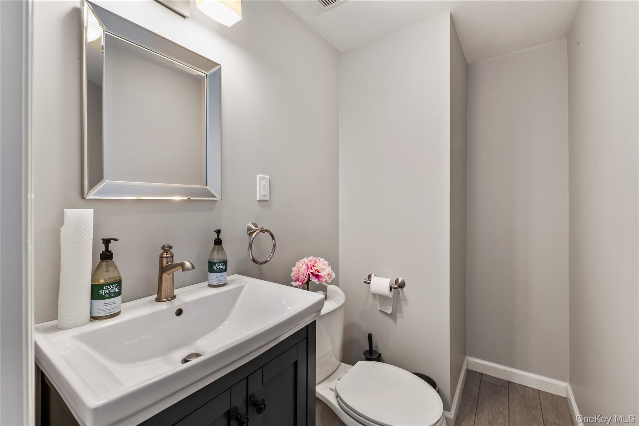 154-96 Riverside Drive Queens, NY 11357 - Photo 24 of 27 a bathroom with a sink toilet and vanity