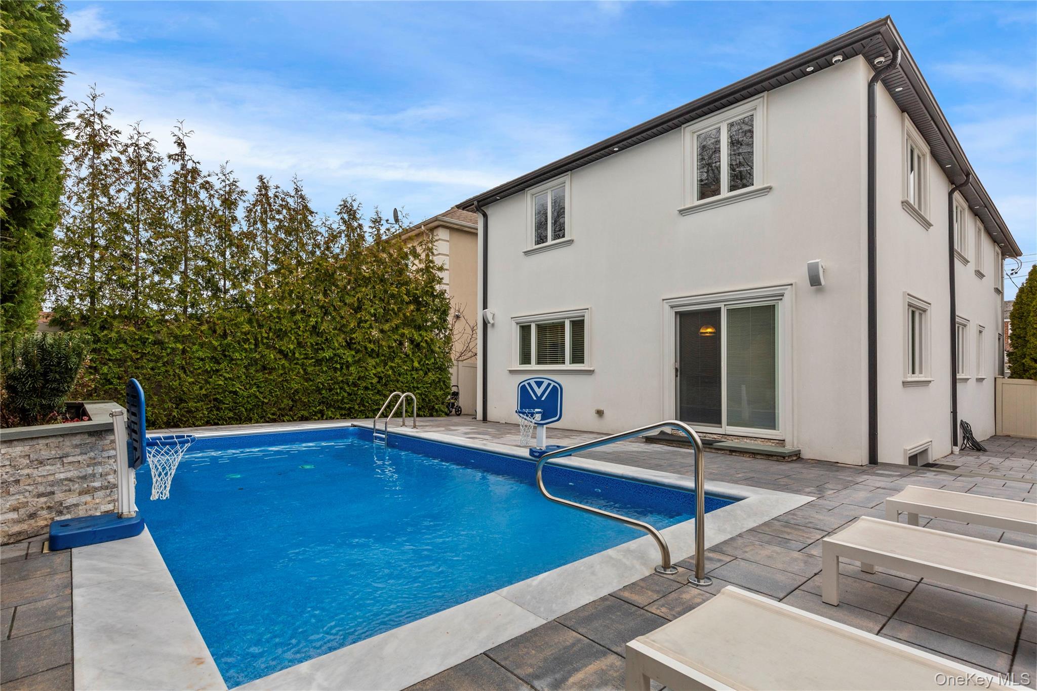 154-96 Riverside Drive Queens, NY 11357 - Photo 25 of 27 a view of a house with pool and sitting area