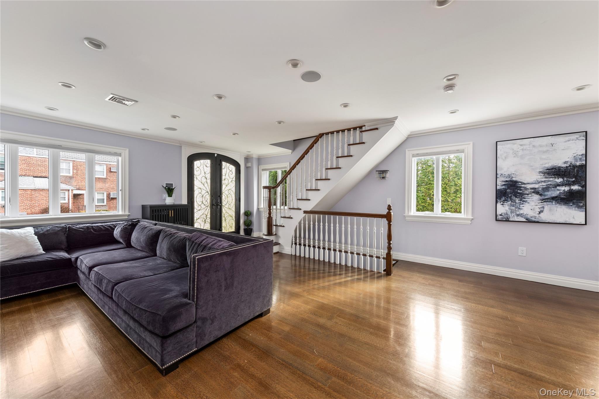 154-96 Riverside Drive Queens, NY 11357 - Photo 4 of 27 a living room with furniture and wooden floor