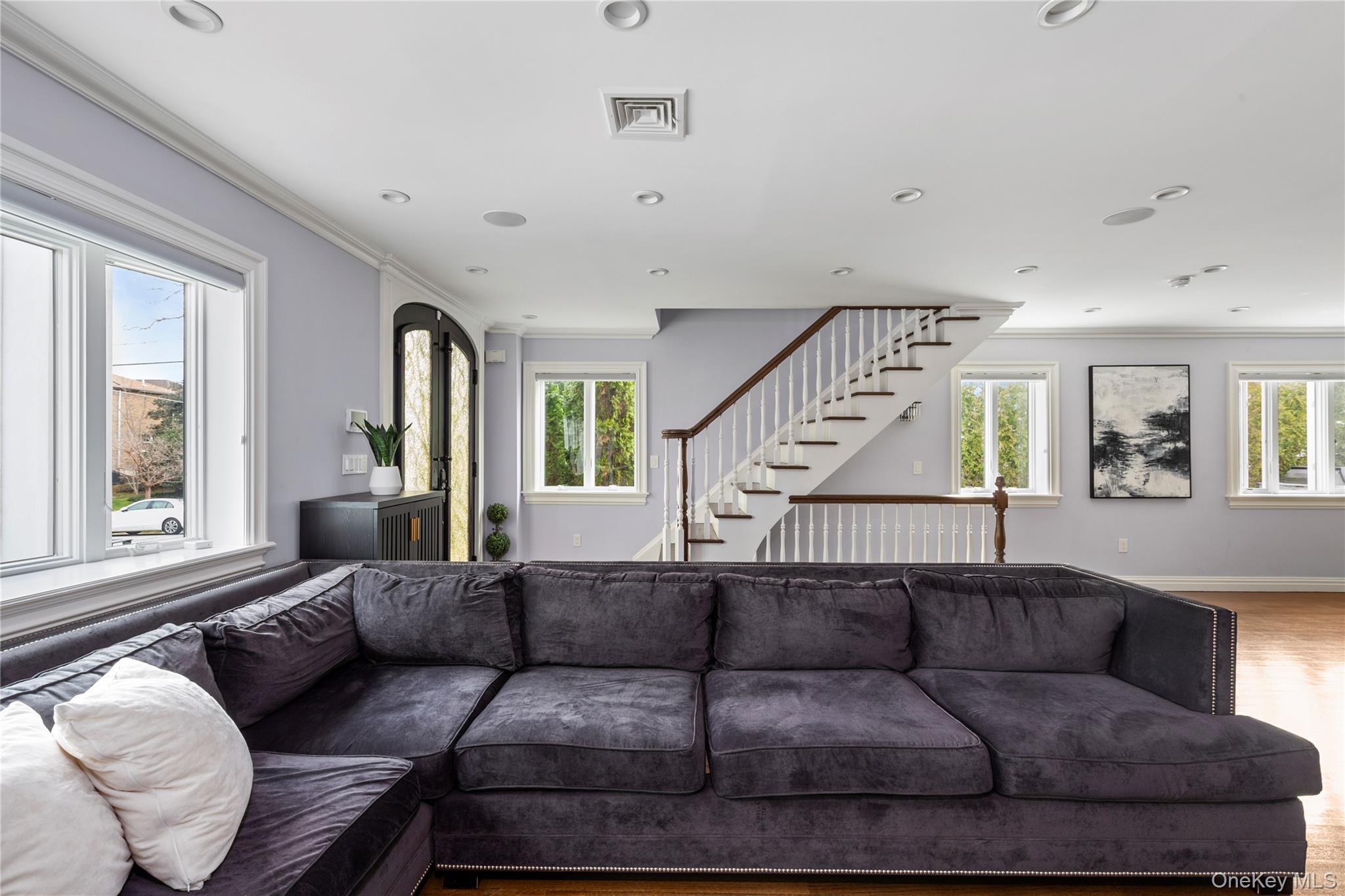 154-96 Riverside Drive Queens, NY 11357 - Photo 7 of 27 a living room with furniture and wooden floor