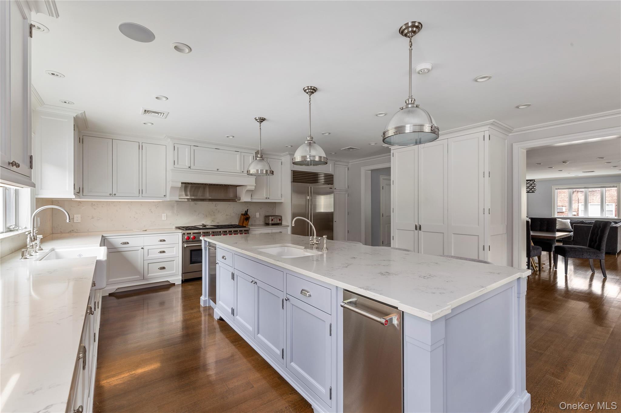 154-96 Riverside Drive Queens, NY 11357 - Photo 10 of 27 a large kitchen with kitchen island a stove a sink a center island and cabinets