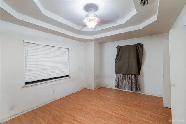 a bedroom with a bed and a chair