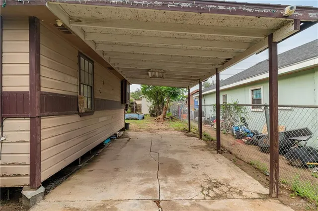 a view of a porch with wooden floor and roof