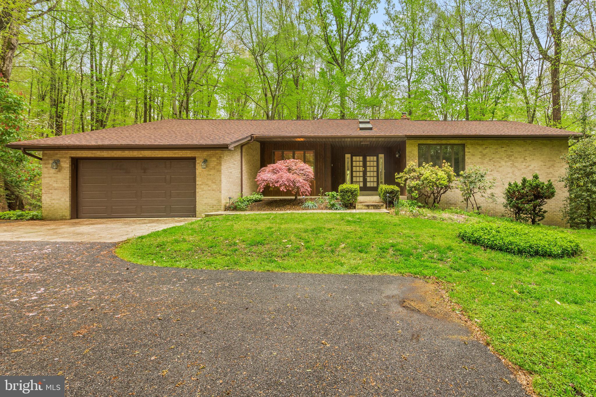 3200 Hickory Ridge Road Dunkirk, MD 20754 - Photo 1 of 44 a front view of a house with a yard and garage