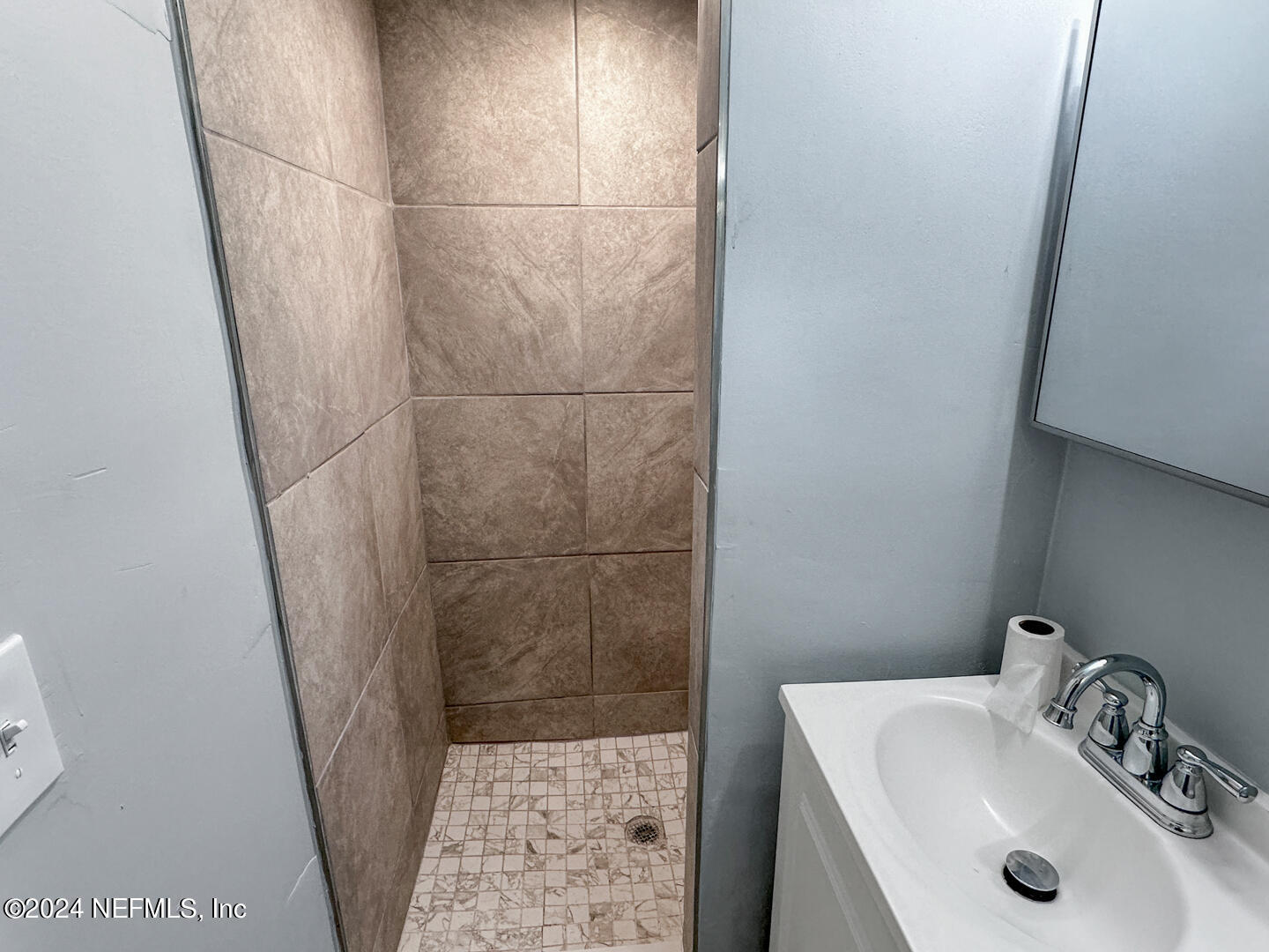 5142 Moncrief Road Jacksonville, FL 32209 - Photo 12 of 27 a bathroom with a sink and shower