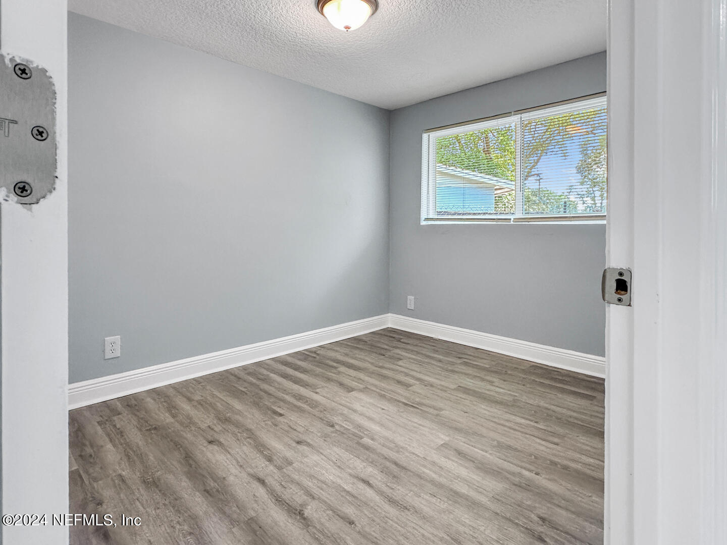 5142 Moncrief Road Jacksonville, FL 32209 - Photo 16 of 27 wooden floor in an empty room