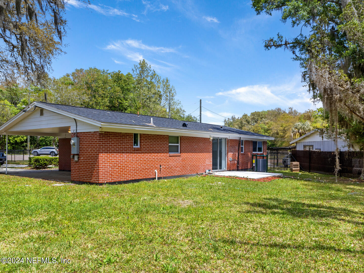 5142 Moncrief Road Jacksonville, FL 32209 - Photo 20 of 27 a front view of a house with a yard and garage