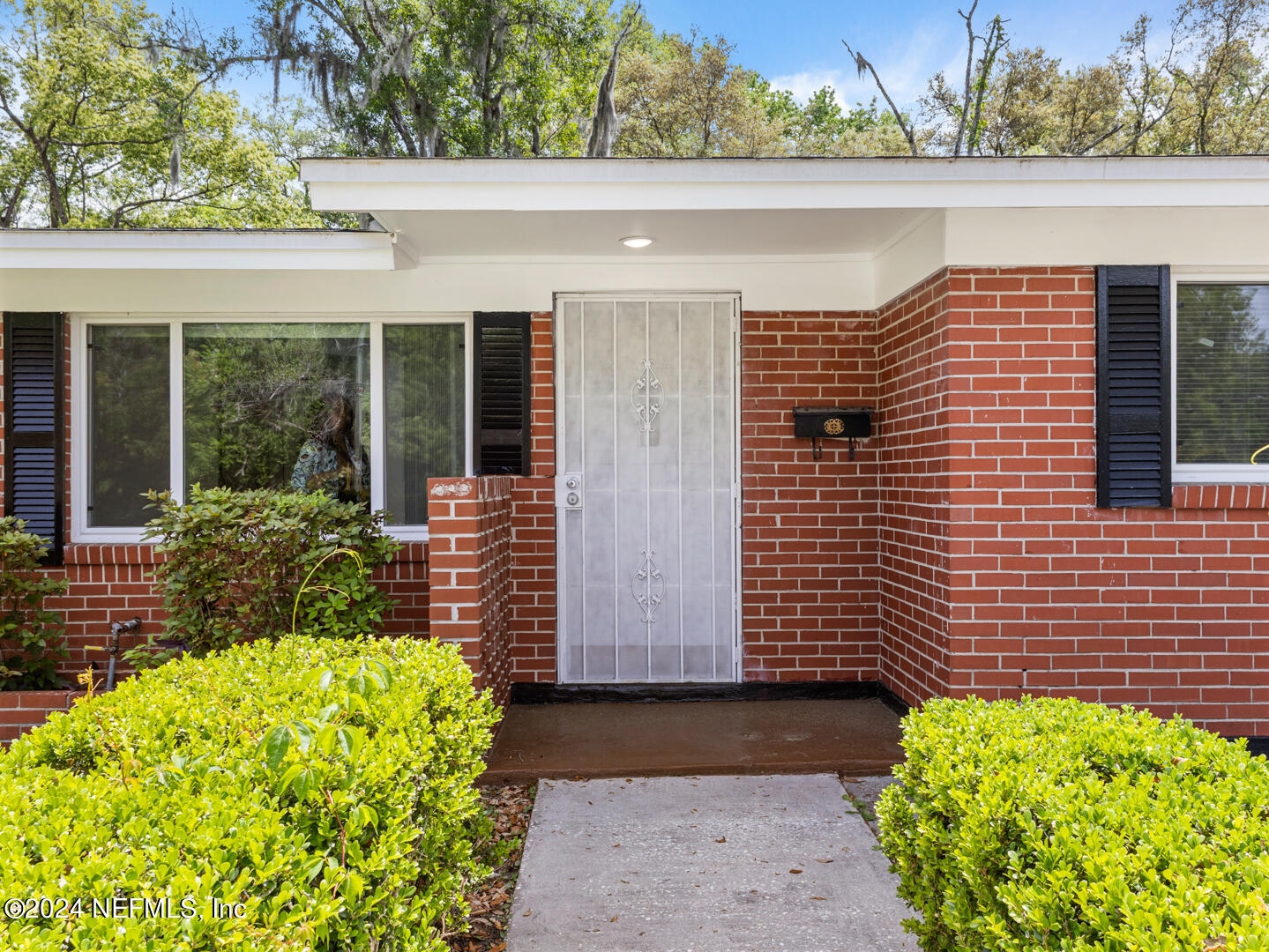 5142 Moncrief Road Jacksonville, FL 32209 - Photo 4 of 27 a front view of a house with a yard