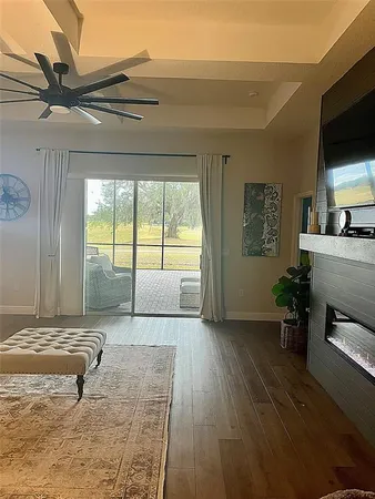 a view of a livingroom with furniture and a flat screen tv