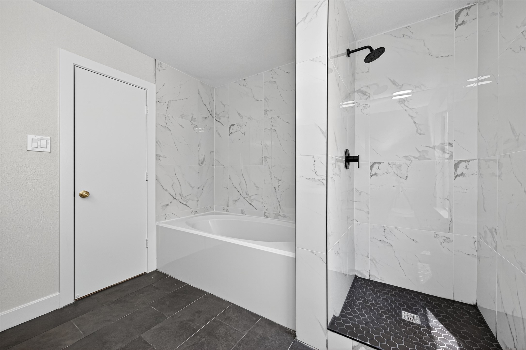 19515 Fletcher Way Drive Houston, TX 77073 - Photo 17 of 27 a bathroom with a bathtub and a shower