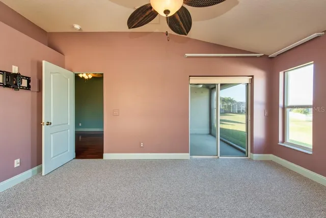 an empty room with windows and closet
