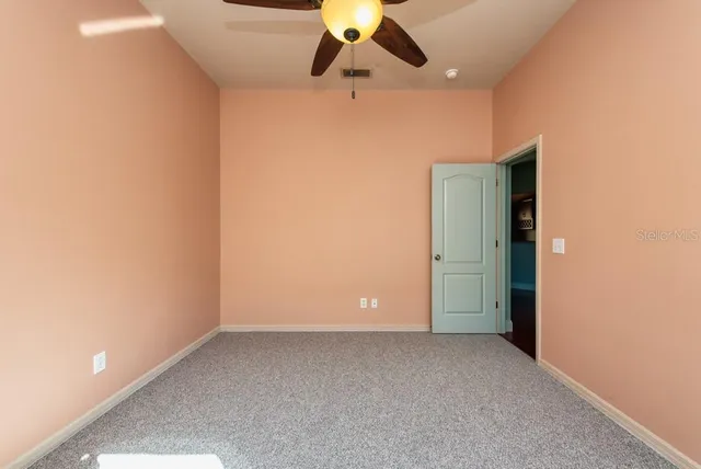 a view of room with ceiling fan