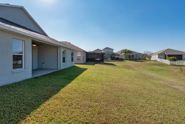 a view of a patio with a yard