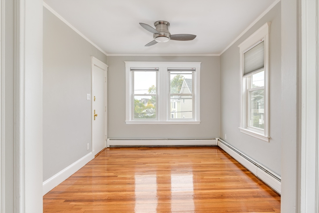 43 Mill Street, Unit 43A Quincy, MA 02169 - Photo 3 of 10 a view of empty room with wooden floor and fan