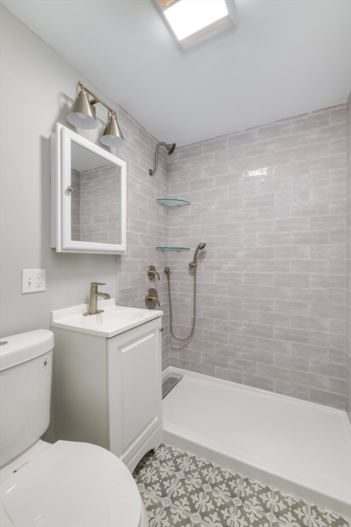 43 Mill Street, Unit 43A Quincy, MA 02169 - Photo 5 of 10 a bathroom with a sink a toilet and bathtub