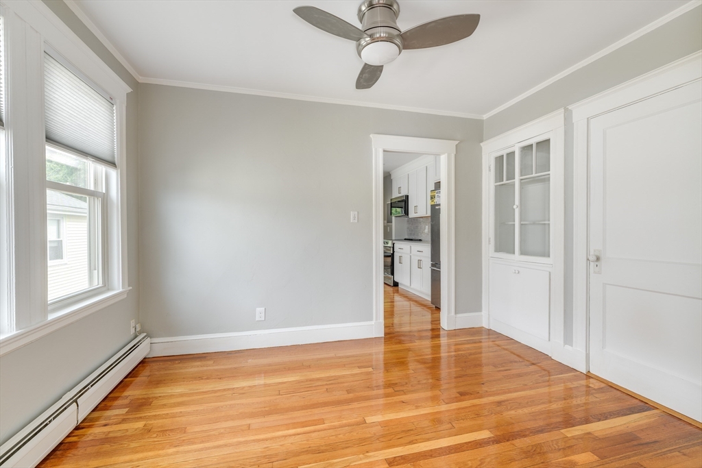 43 Mill Street, Unit 43A Quincy, MA 02169 - Photo 9 of 10 a view of empty room with wooden floor and fan