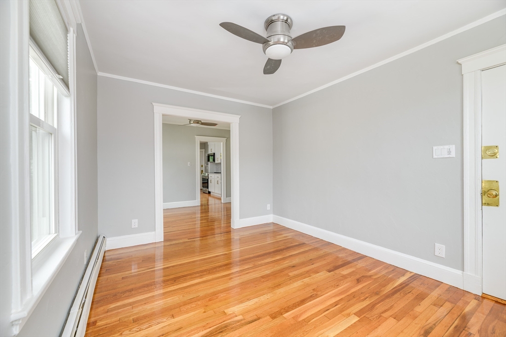 43 Mill Street, Unit 43A Quincy, MA 02169 - Photo 10 of 10 a view of empty room with wooden floor and fan