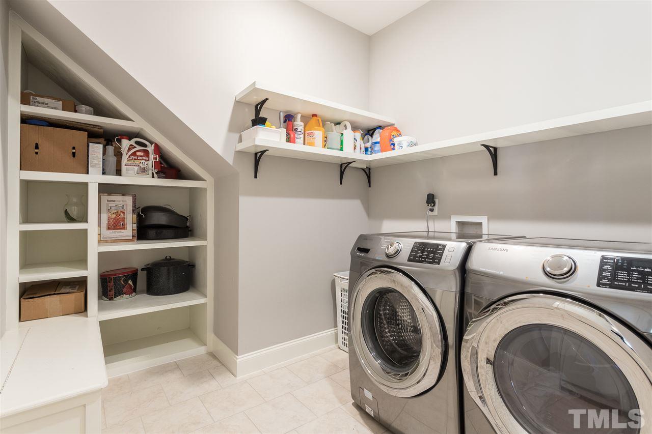 3135 Dixon Road Durham, NC 27707 - Photo 15 of 29 spacious laundry room with built-in shelving.