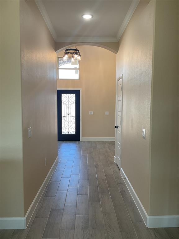 7354 Ne Creek Rice, TX 75155 - Photo 2 of 12 a view of a hallway with wooden floor