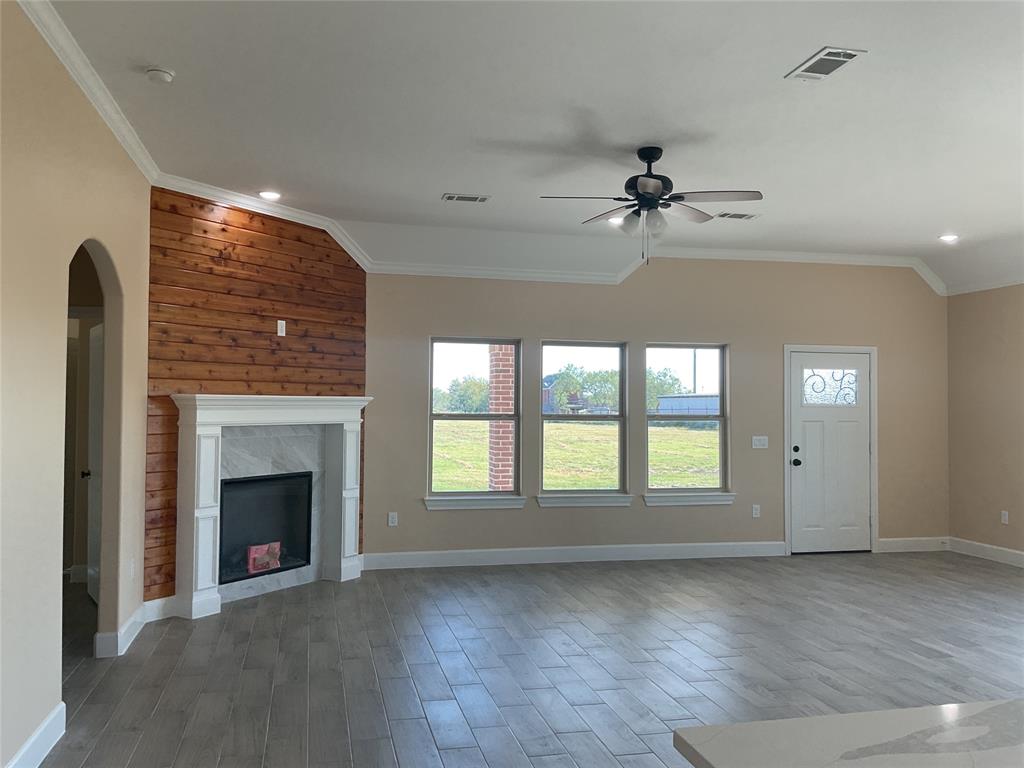 7354 Ne Creek Rice, TX 75155 - Photo 3 of 12 wooden floor fireplace and windows in an empty room