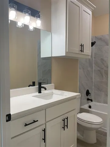 a bathroom with a sink and a toilet