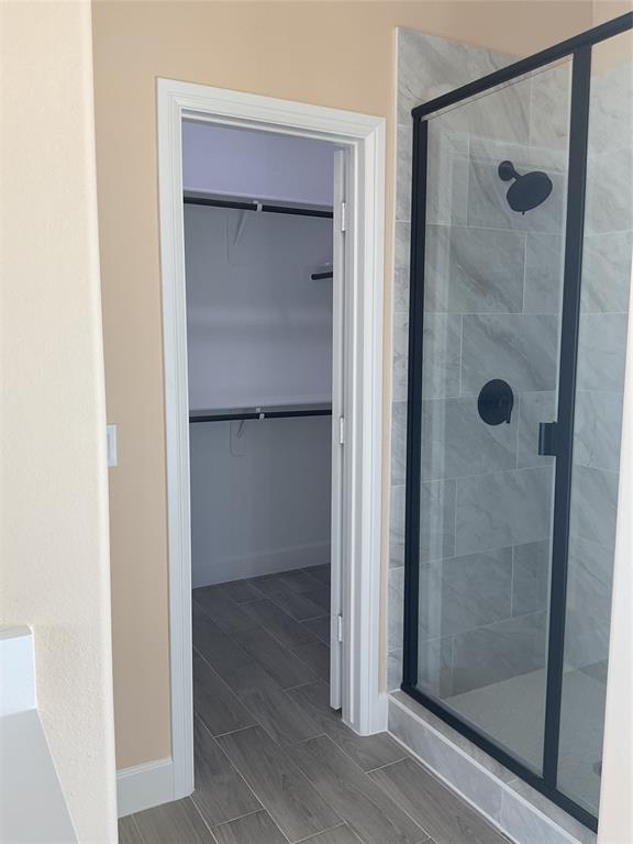 7354 Ne Creek Rice, TX 75155 - Photo 10 of 12 a bathroom with a glass shower door