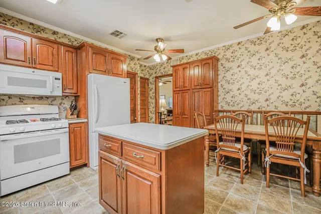 a bathroom with a sink a toilet and a shower curtain
