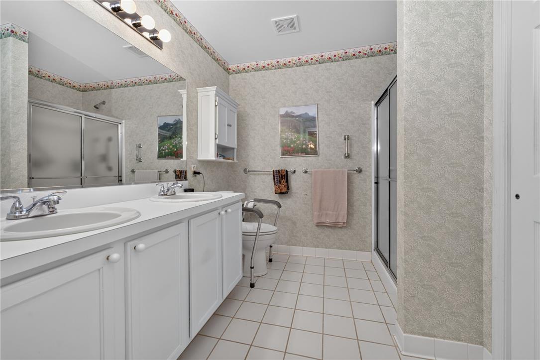 198 Park Ridge Drive Easton, PA 18040 - Photo 13 of 28 Dual vanities and a spacious shower elevate daily routines in this well-appointed bathroom.