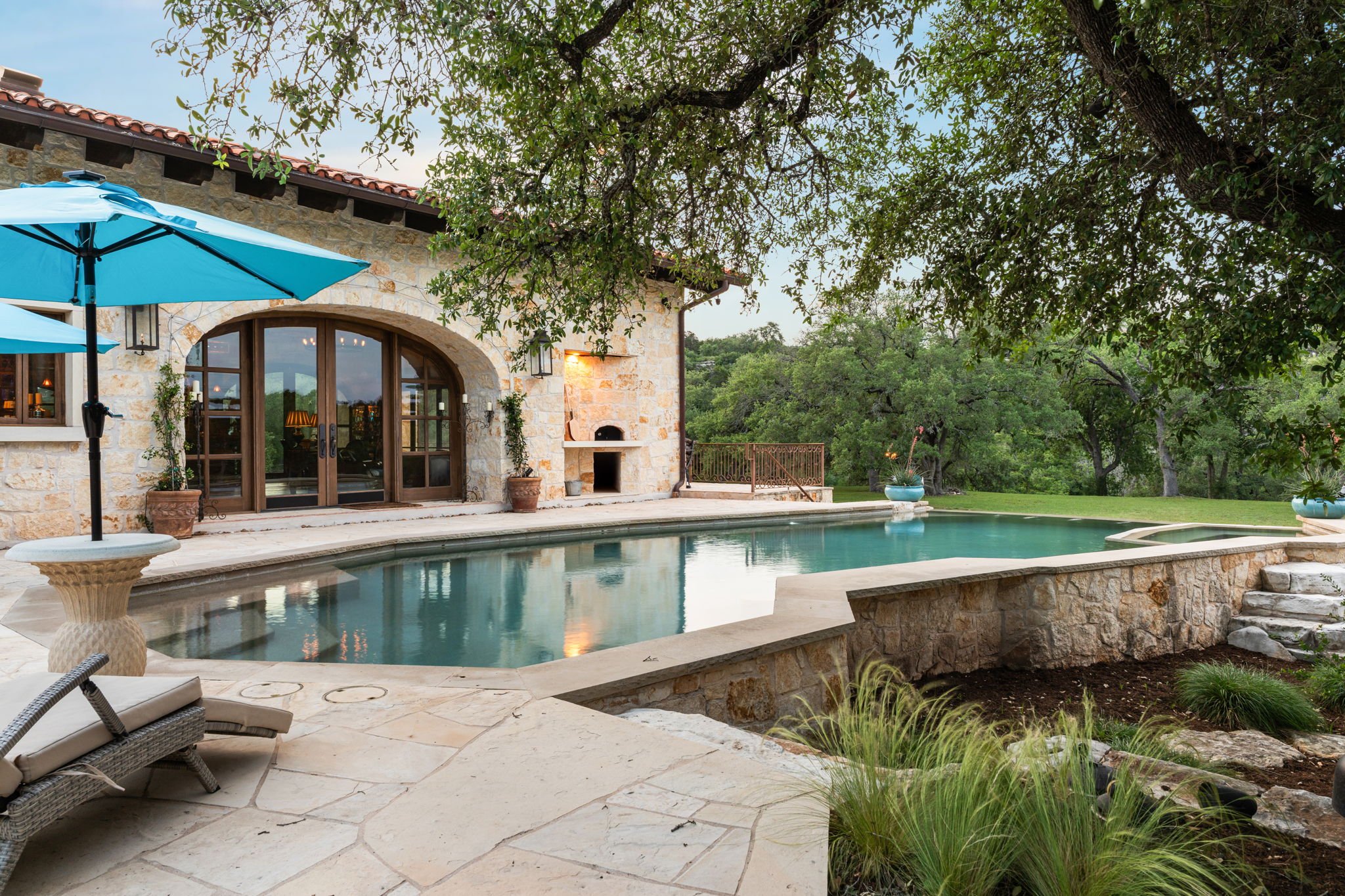 11941 Overlook Pass Austin, TX 78738 - Photo 33 of 40 Exterior stone facade with terra cotta roof tiles