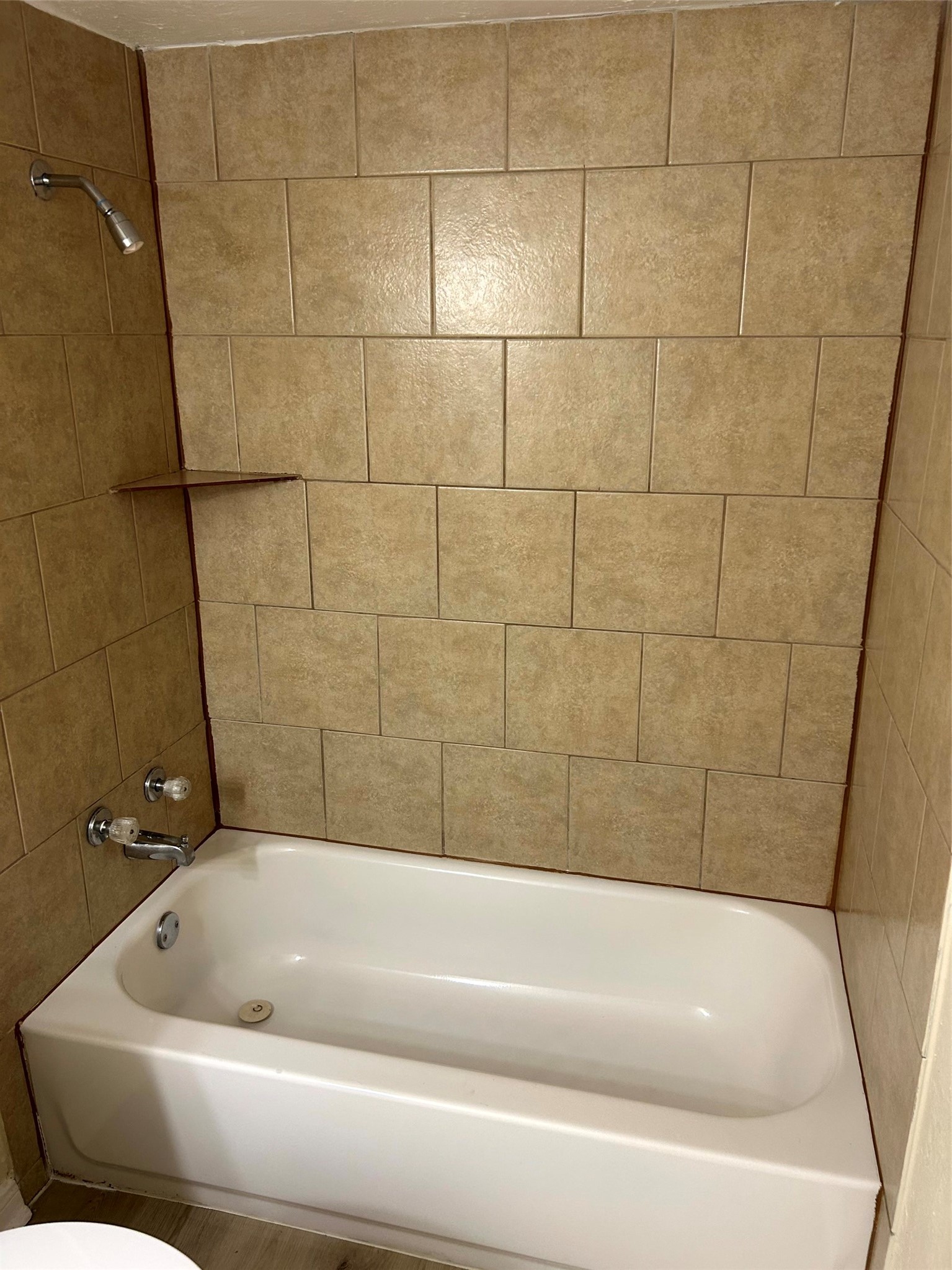 5018 Ridgecreek Drive Houston, TX 77053 - Photo 11 of 18 a bathroom with a bathtub