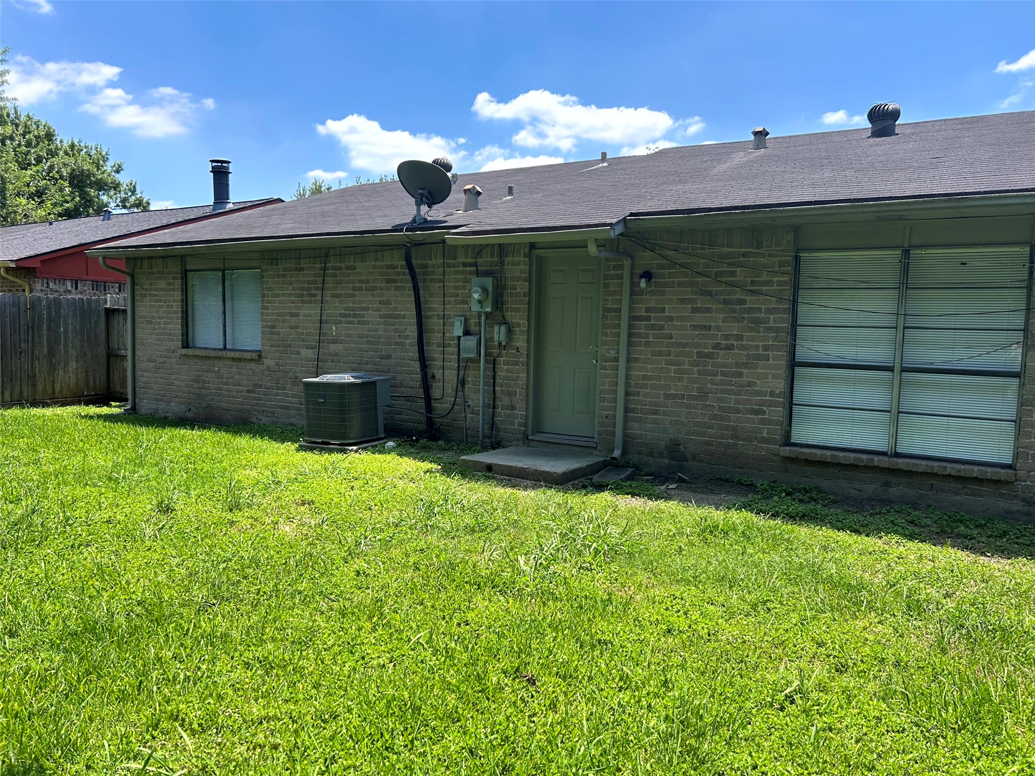 5018 Ridgecreek Drive Houston, TX 77053 - Photo 17 of 18 a front view of a house with a yard