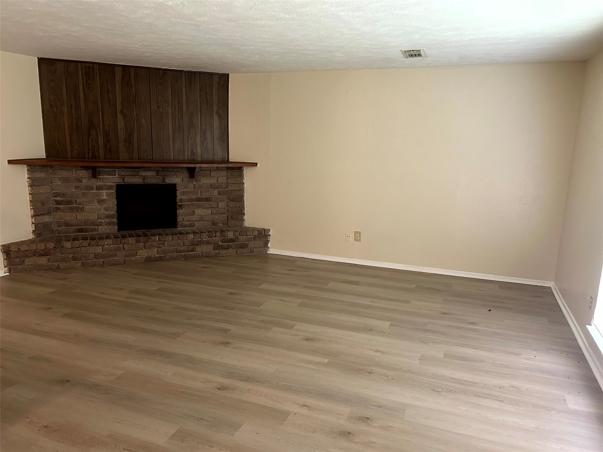 5018 Ridgecreek Drive Houston, TX 77053 - Photo 3 of 18 a view of a kitchen with wooden floor and a sink