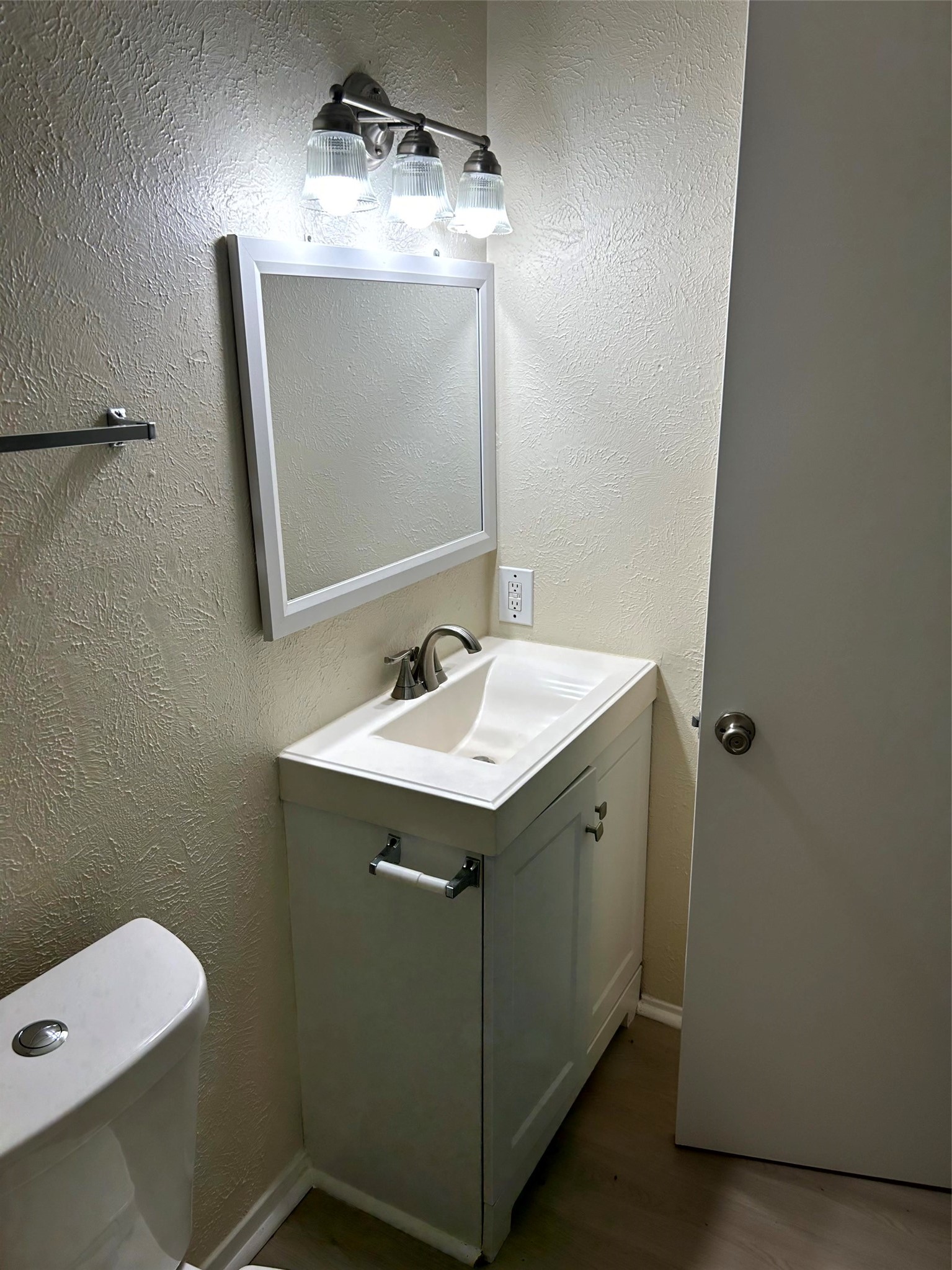 5018 Ridgecreek Drive Houston, TX 77053 - Photo 10 of 18 a bathroom with a sink vanity and mirror