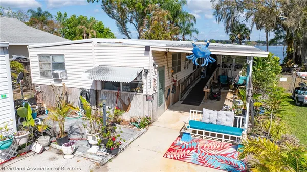a view of a backyard with plants and patio