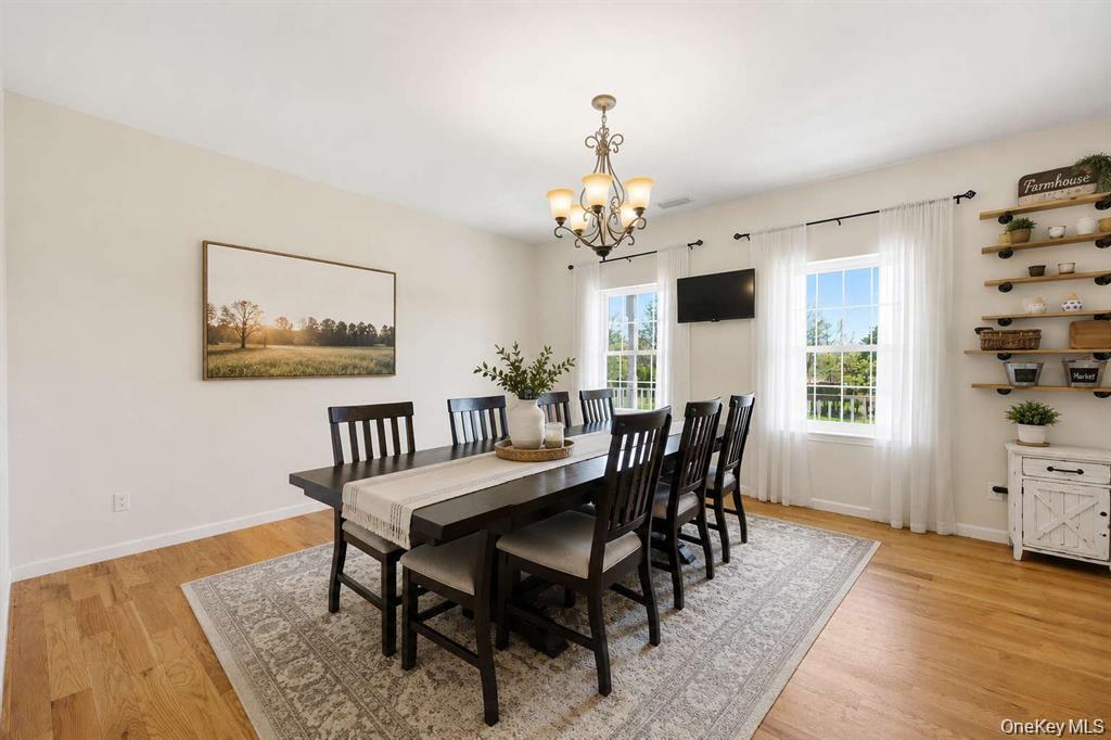 133 Old Chester Road Goshen, NY 10924 - Photo 11 of 33 a view of a dining room with furniture window and wooden floor