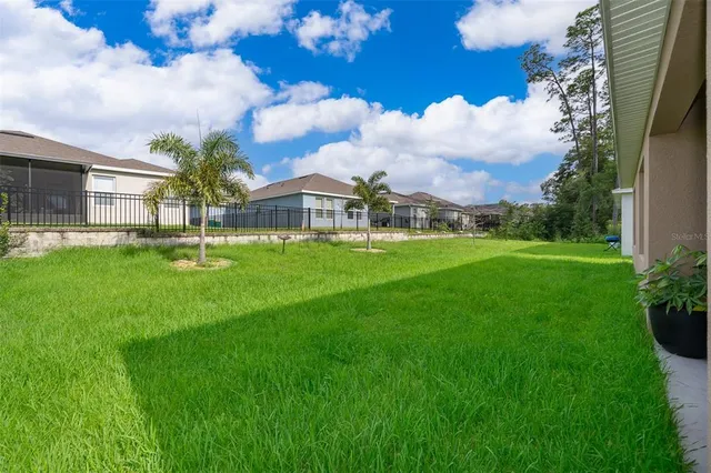 a view of a garden with a house
