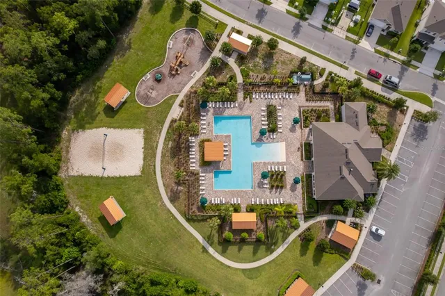an aerial view of residential house with outdoor space and swimming pool