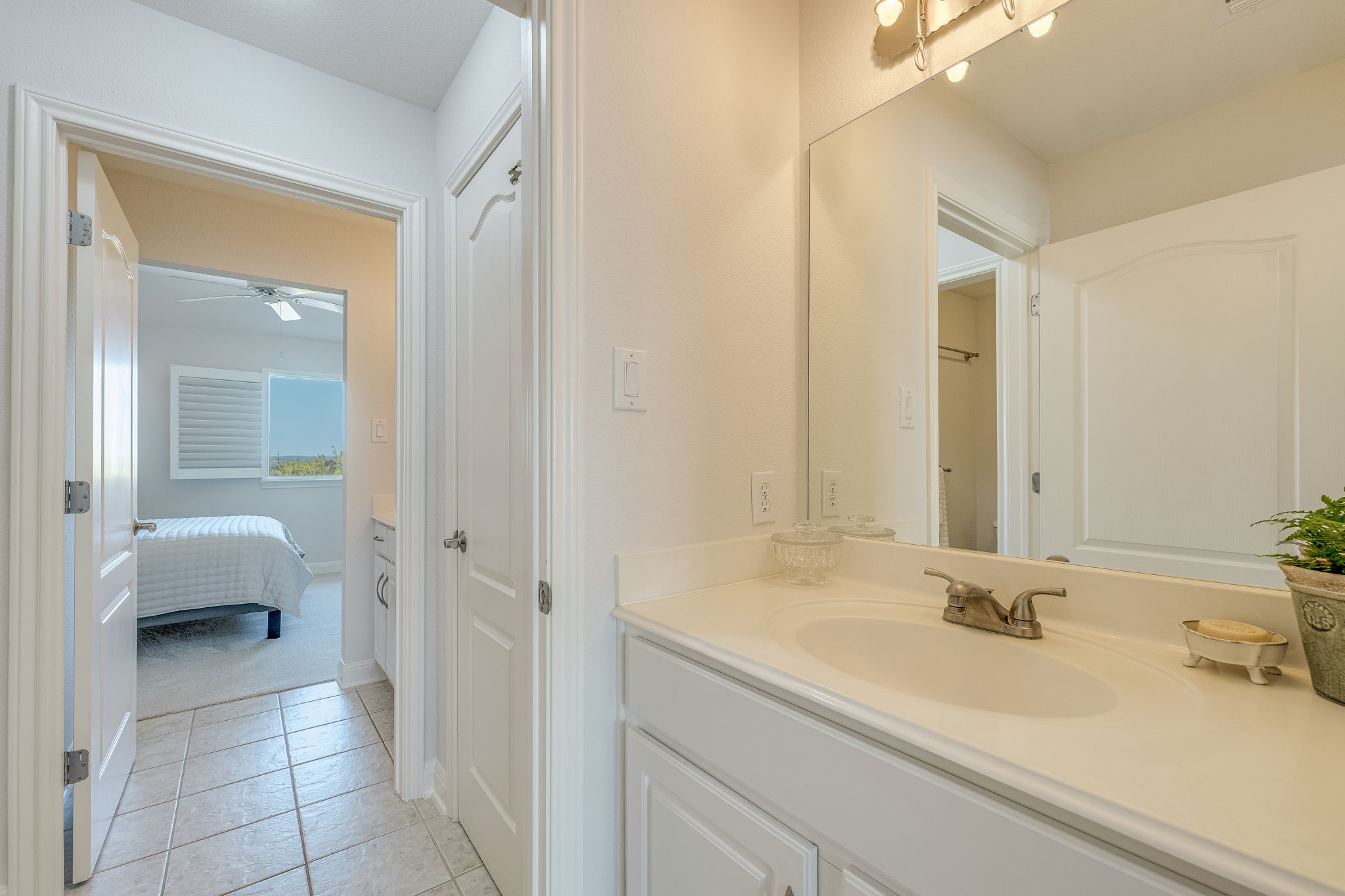 4424 Lago Viento Austin, TX 78734 - Photo 26 of 38 A Jack-n-Jill bath connect two bedrooms. Each room has its own private vanity.