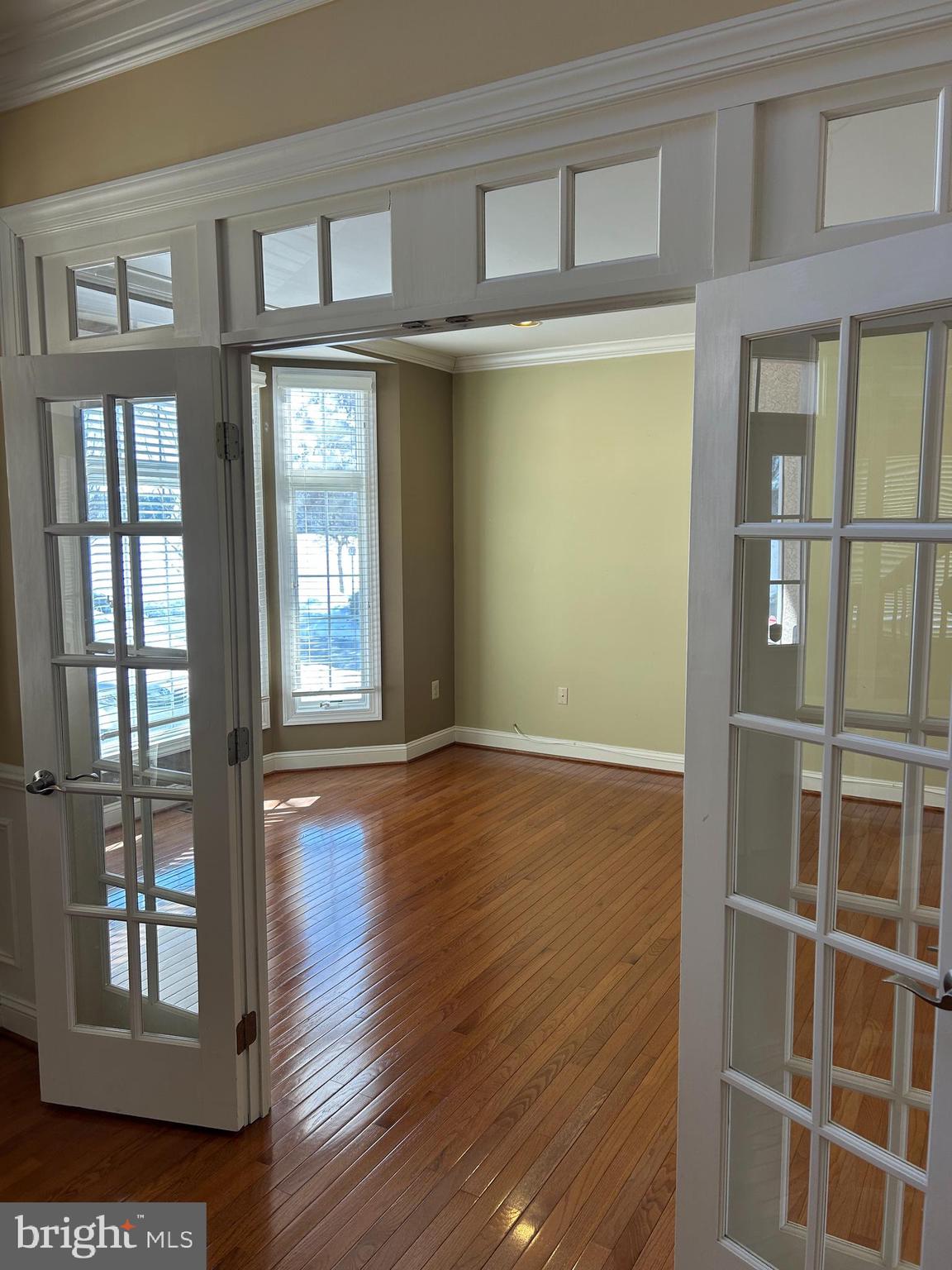 310 Waynebrook Drive Chester Springs, PA 19425 - Photo 14 of 39 an empty room with wooden floor and windows
