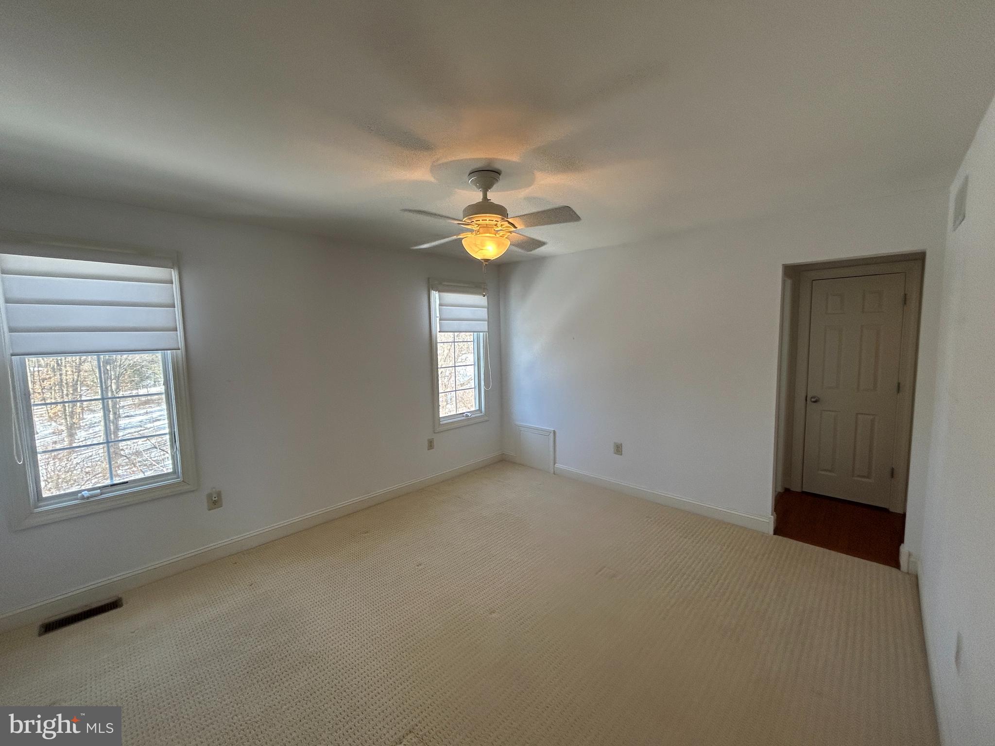 310 Waynebrook Drive Chester Springs, PA 19425 - Photo 19 of 39 wooden floor in an empty room with a window