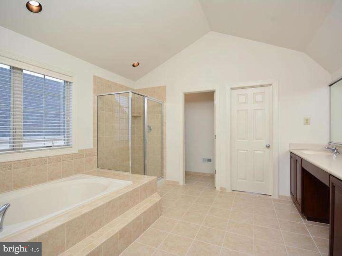 310 Waynebrook Drive Chester Springs, PA 19425 - Photo 2 of 39 a spacious bathroom with a bathtub and a shower