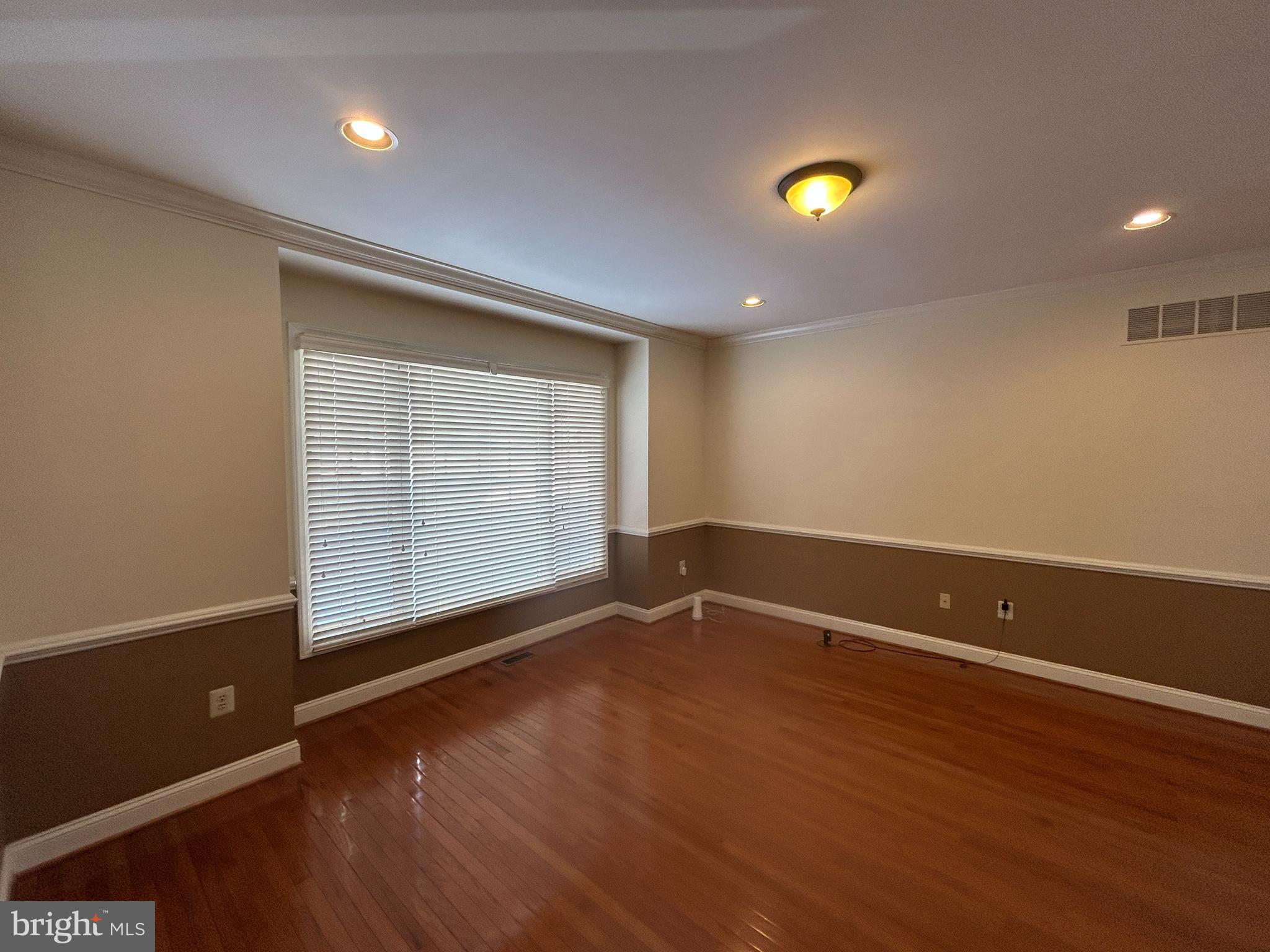 310 Waynebrook Drive Chester Springs, PA 19425 - Photo 28 of 39 an empty room with wooden floor and windows